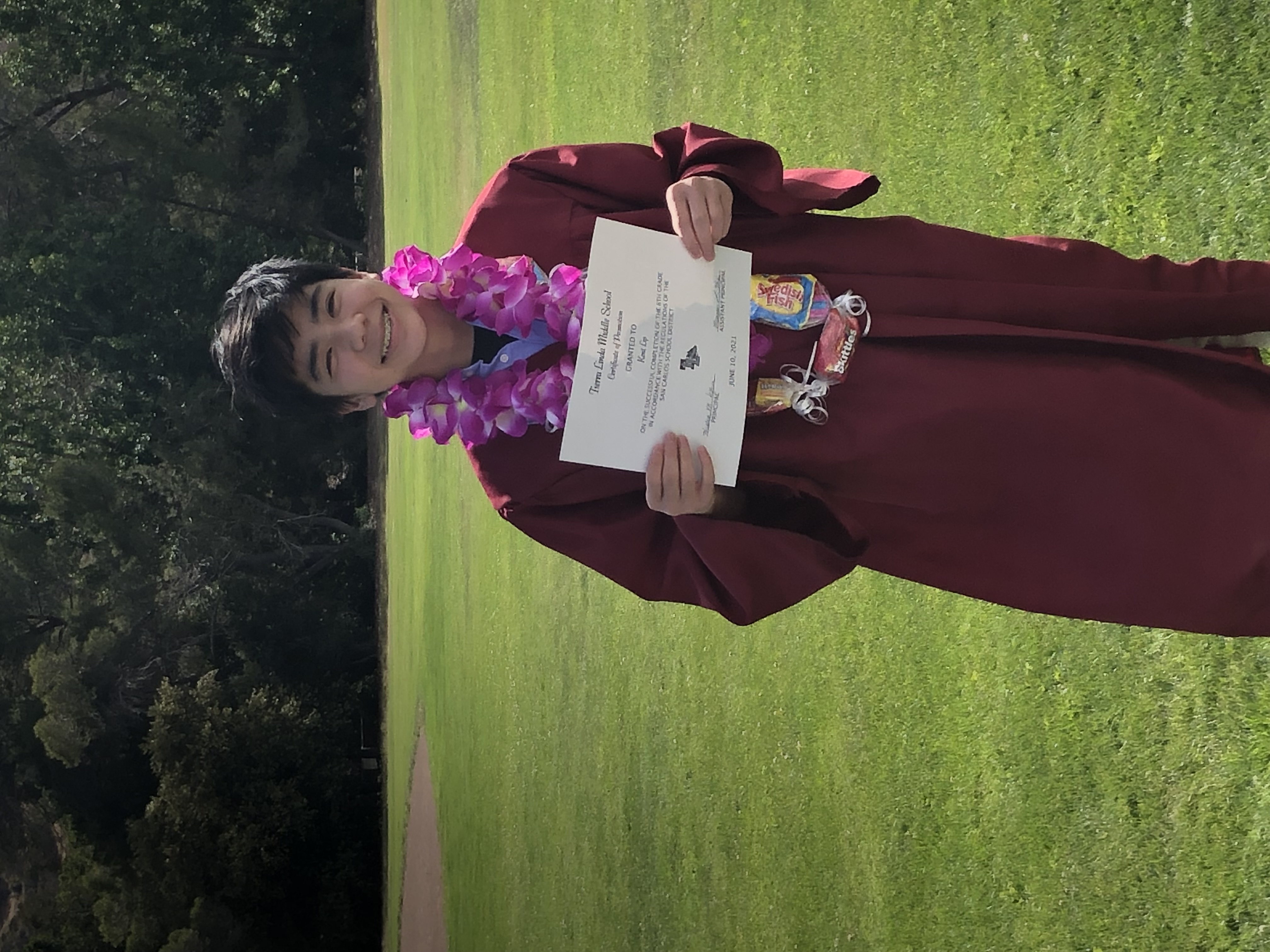 Picture of me graduating from Middle School